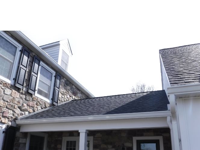 Dark gray roof on a stone house